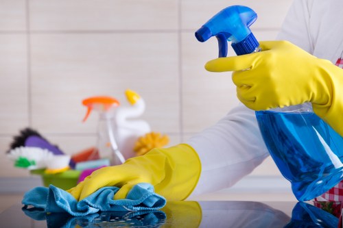 Carpet cleaning professional preparing equipment safely at a residential property